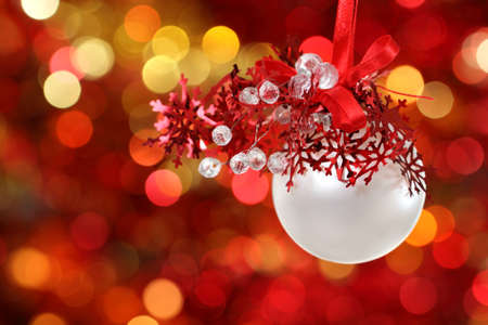 Red and white Christmas tree decorations on lights backgroundの写真素材