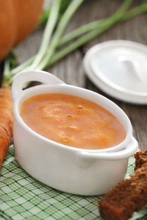 Bowl of the vegetable soup on the tableの写真素材