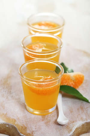 Fruit tangerine jelly in the glass bowl の写真素材