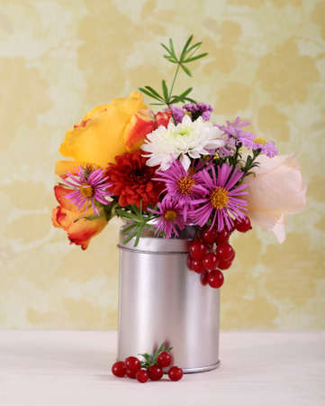 Bouquet of autumn flowera in the iron potの写真素材