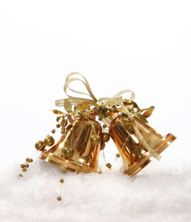 Golden Christmas bell tree decorations on white backgroundの写真素材