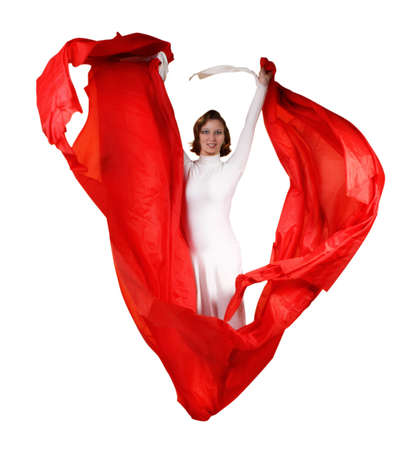 Young woman in white dress with red fabric over white の写真素材