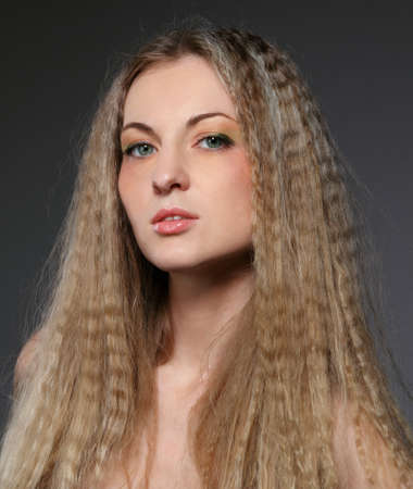Beautiful blond girl with bright make up. Close up portraitの写真素材