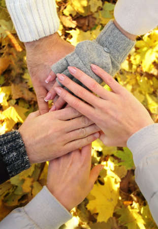 Hands of best friends together outdoor. Autumnの写真素材