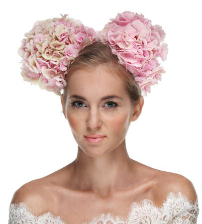 Portrait of a beautiful blond girl with hydrangea in her hairの写真素材