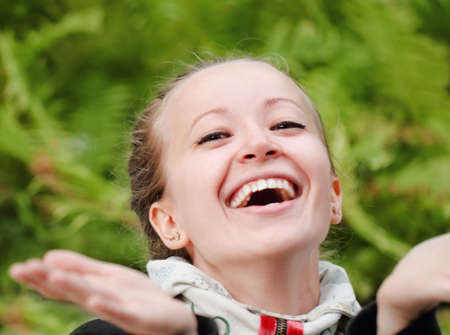 Young smiling blonde woman in the parkの写真素材