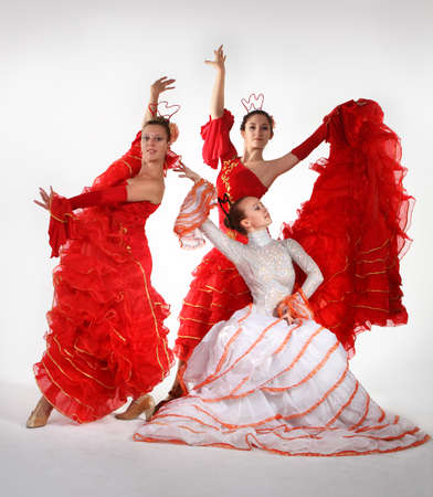 Three young women dancing flamenco in studioの写真素材