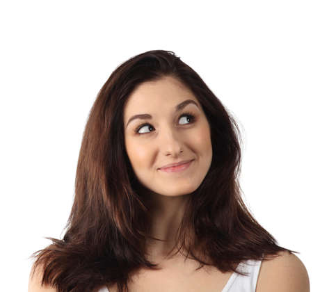 Beautiful thoughtful woman looking up. Isolated over whiteの写真素材
