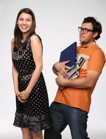 Portrait of a young beautiful funny couple in studioの写真素材