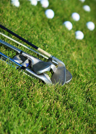 Golf clubs and golf balls on the green grass background
の写真素材