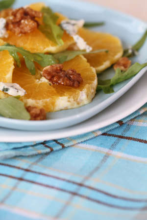 Fresh salad with oranges, walnuts and cheeseの写真素材