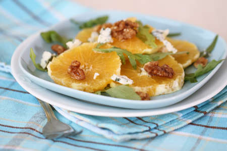 Fresh salad with oranges, walnuts and cheeseの写真素材