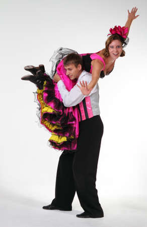 Dancing couple in studio. Crazy character portrait. Cancanの写真素材