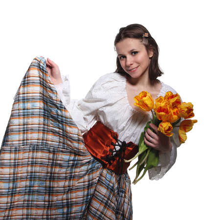 Beautiful smiling country girl with tulip flowersの写真素材