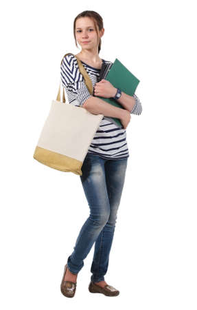 Teenager schoolgirl with textbooks against white background
の写真素材