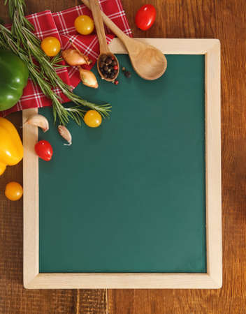 Vegetables still life with green board with copy spaceの写真素材