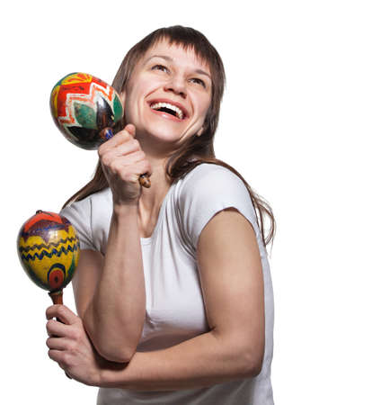 Happy smiling woman with maracas. Isolated on whiteの写真素材