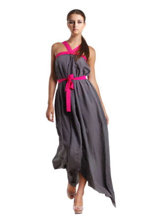 Portrait of the beautiful brunette girl in long gray dressの写真素材