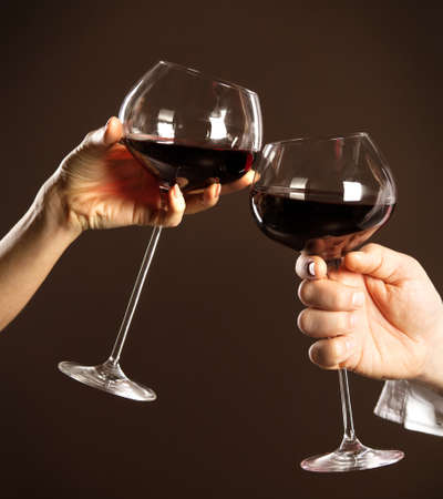Celebration. People holding glasses of white wine making a toastの写真素材