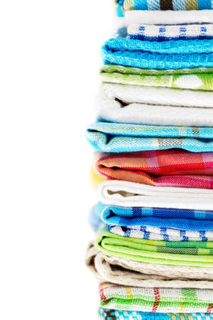 Pile of linen kitchen towels isolated on white backgroundの写真素材