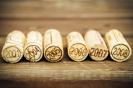 Dated wine bottle corks on the wooden background. Close upの写真素材