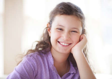 Happy little cute girl a on white background