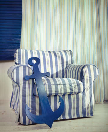 One classic armchair against a white wall and floor. Copy spaceの写真素材