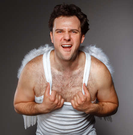 Mr. Angel with white wings. Crazy character portraitの写真素材