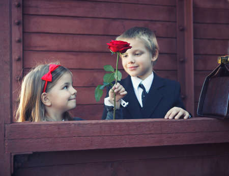 little boy and little girl on the retro trainの写真素材