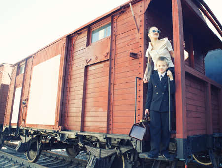 Woman with her son traveling in the retro train