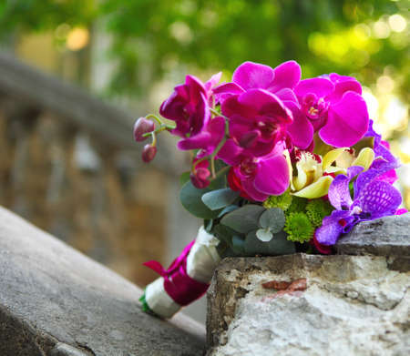 Beeautiful wedding bouquet of beige and purple orchidsの写真素材