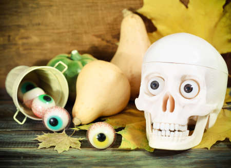 Creepy skull, halloween sweets and pumpkins for Halloween partyの写真素材