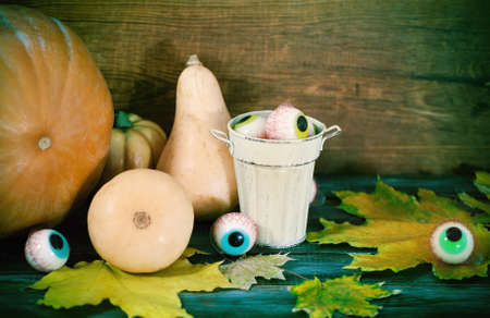 Halloween sweets, autumn leaves and pumpkins for Halloween partyの写真素材