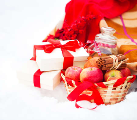 Christmas still life with a Christmas decorations, cookies and presents nestling in fresh snowの写真素材
