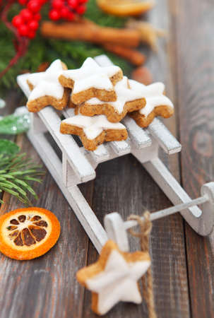Christmas cookies with Christmas decorations on the wooden boardの写真素材