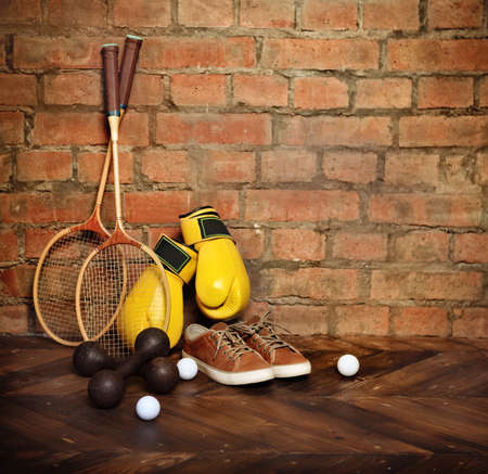 Sports equipment near the brick wall.Retro styleの写真素材