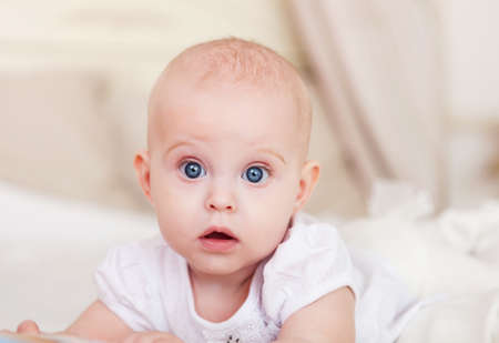 Close up portrait of the six month old baby indoor
