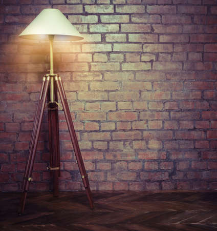 Interior of loft with retro lamp over brick wallの写真素材