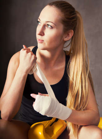 Portrait of a woman boxer wearing white strap on wristの写真素材