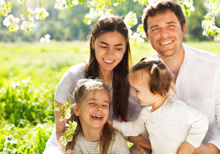 Happy young family with two children outdoors. Spring dayの写真素材