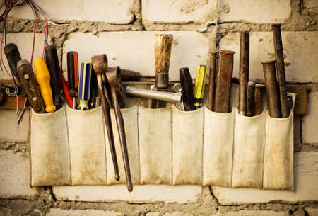 Tools renovation on grunge old brick wall. Close upの写真素材