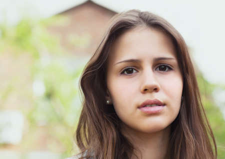 Portrait of a beautiful teen girl in sunset lightの写真素材