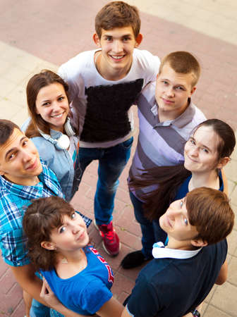 Group of smiling teenagers standing outdoors. Friendship conceptの写真素材