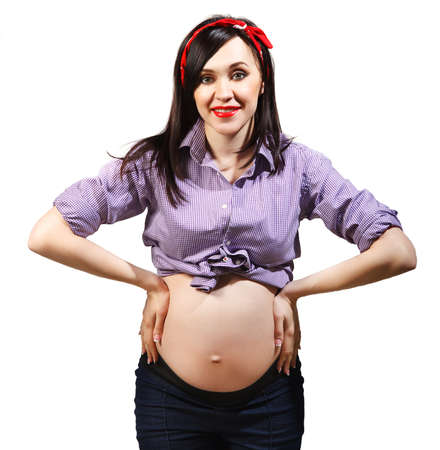 Smilling young funny pregnant woman in pin up styleの写真素材