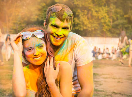 Portrait of happy couple in love on holi color festivalの写真素材