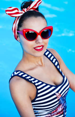 Beautiful pin up girl near the swimming pool. Summertimeの写真素材
