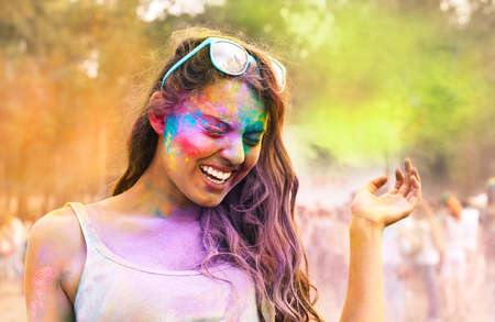 Portrait of happy young girl on holi color festivalの写真素材