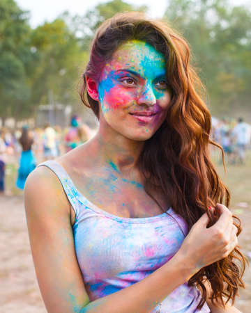 Portrait of happy young girl on holi color festivalの写真素材