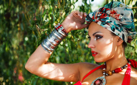 Beautiful fashionable woman wearing colored turban