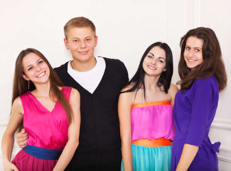 Four happy teen friends having fun together